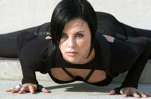 Charlize Theron tries a new yoga position, favoured mostly by the spectators.