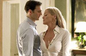 David Morrissey notices Sharon has some plastic caught in her shirt.  Oh no, hang on, that's her tit.