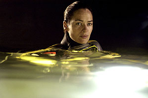 Lena Headey, backlit in an underground cave.