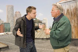 Leonardo DiCaprio tries to show Martin Sheen what the vulture that attacked him looked like.