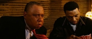 Barry Shabaka Henley follows his tie's lead while Chiwetel Ejiofor looks on.
