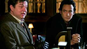 John Cusack regrets telling Oliver Platt about his misshapen appendage.