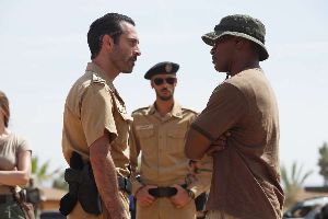 Ashraf Barhom resents Jamie Foxx wearing a sillier hat than his boss.