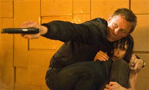 Daniel Craig protects Olga Kurylenko from the nasty men who want to steal their cheese wall. 