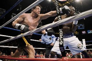 Antonio Tarver obediently pretends to be punched by a pensioner.