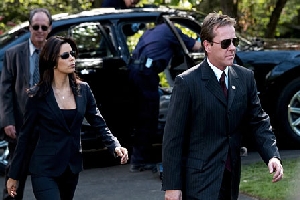 Eva Longoria's low cut is to distinguish her from the Men In Black.