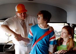 Kevin Heffernan as Ron Wilson the Bus Driver, with Michael Angarano.