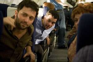 Passengers strain to watch the stewardess with no underwear.